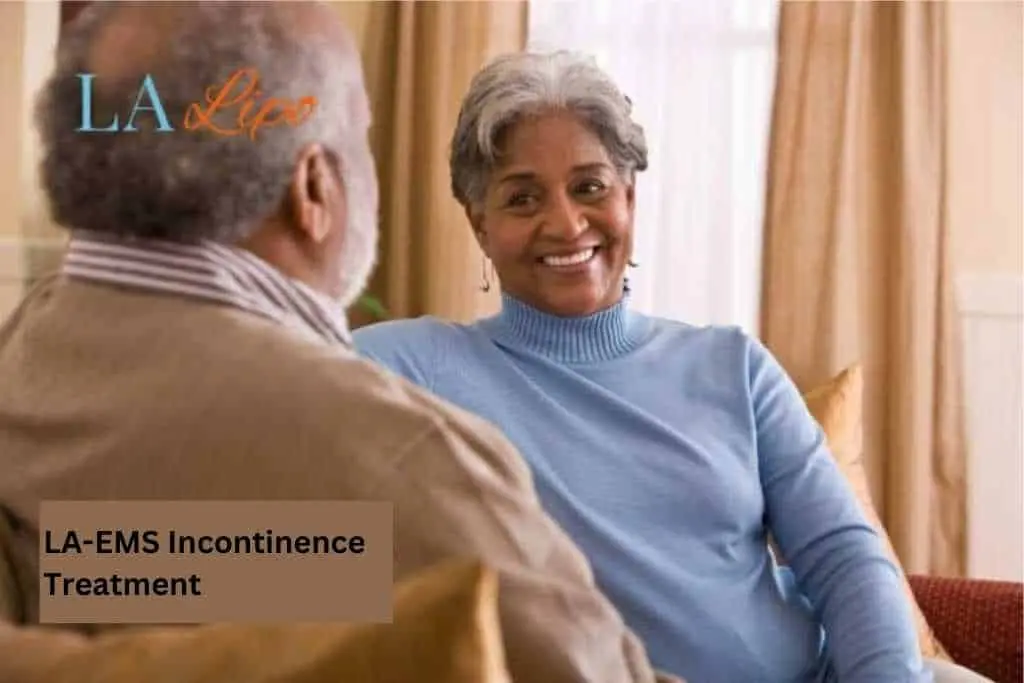 Couple sat smiling at each other - LA-EMS treatment Walsall