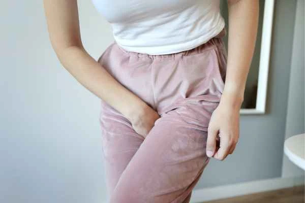 older woman running to the toilet because of urinary incontinence Walsall